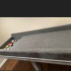 ​Carpeted table with pool balls and areas to catch the balls on either end. Seen at an estate sale.