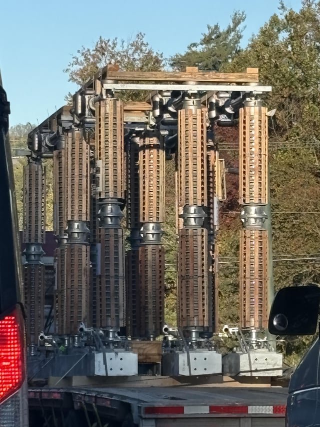 ​Saw this structure on a flatbed this morning. Metal, looks electrical, with wood all around it (ostensibly for shipping).