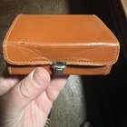​Small leather box made in England, has slots of some sort inside to hold something.