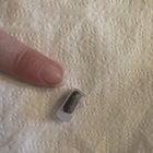 ​Plastic little bullet-shaped piece with metal inside it