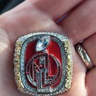 ​Football ring top I think? Found at goodwill. It has magnets on the back And a necklace loop.