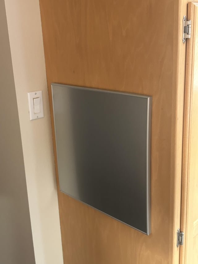 This somewhat shiny grey framed thing is on the side of one of my cupboards in the kitchen.