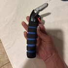 Foam squishy handle that is firm at the core, metal tip. In one of my kitchen drawers and no one is owning up to it