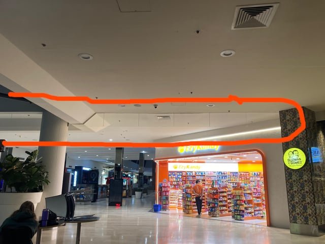 ​Glass barrier hanging from roof of local mall