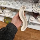 ​S-shape ceramic vessel/container. 20cm long and 4cm tall, floral pattern and ‘STUDIO CERAMIC’ stamped on the base.