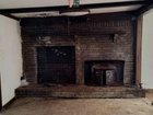 What is this space next to the fireplace (too big for wood storage)?