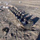 Me and my husband found this long grey and white half tube thingy at the beach. It was pretty light when I nudged it but I’m not sure of the material.