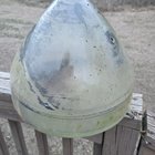 Found in the woods. Thick double paned glass, about 10″ in diameter across the big end. Heavy. Looks like a metal clip or bracket inside. Faint raised line around the outside, like a bevel of some sort? There’s a train track about a mile away. Possible signal light bulb?
