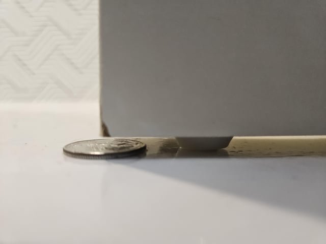 Small white disc or tip on bottom of doors