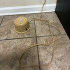 What is this small metal device with a power button that – when plugged in – causes it to make a steady ‘vrrrrr’ and ‘wsshhhh’ sort of noise, like a fan or heater; very small amounts of air are being felt coming out of the various holes/slits, but not with any real power for it to be a fan, etc.