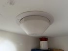 Protruding item from closet ceiling, not a lamp. Threaded collar keeps it in place
