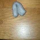 I found it in a pencil case, its malleable and kinda like clay but it goes stringy when you pull it apart.