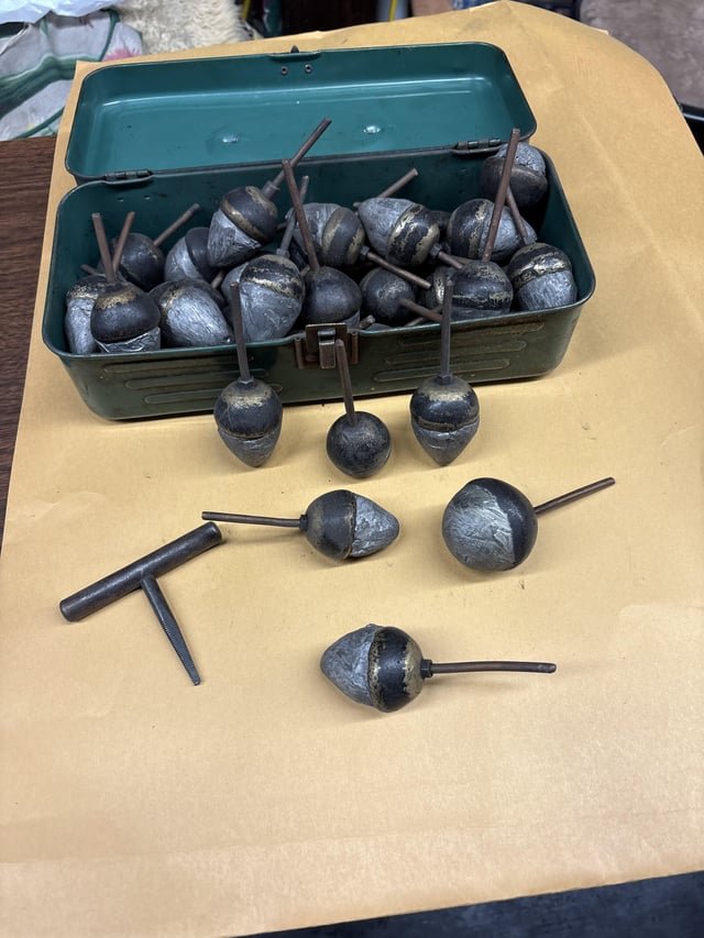 Very heavy (lead?) acorn shaped metal pieces. Cleaning up the back of a car garage. Came with T shaped tool. 40+ years old.