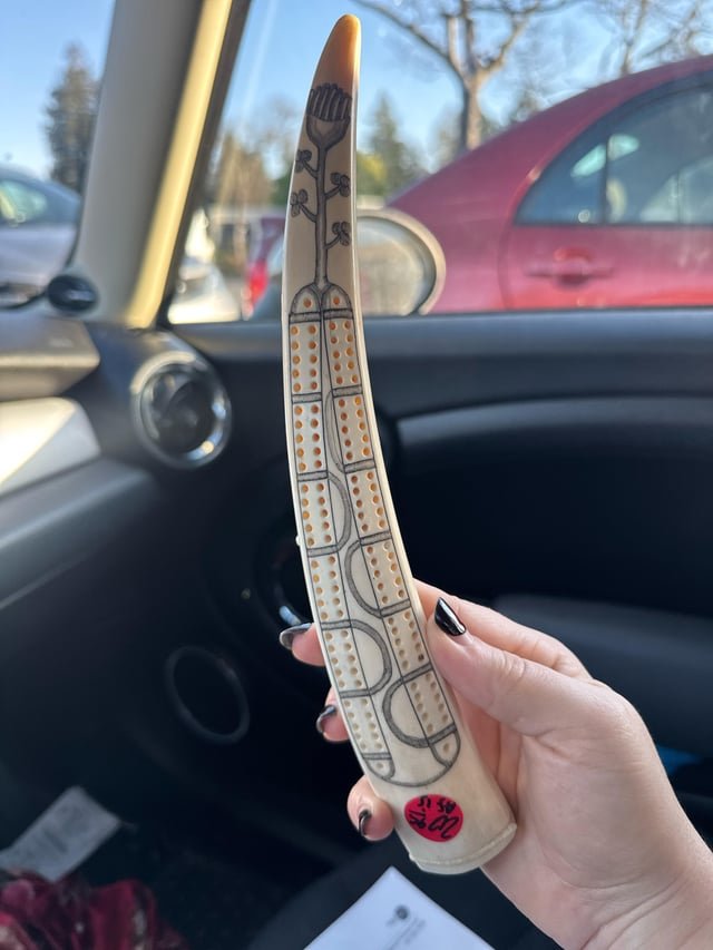 What is this thing I found at the thrift store? Ivory(?Tusk with holes bored in and design