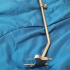 ​Long metal rod with 2 pointed ends. Knob on side allows piece to retract/extend and stay in place, part of something else that the bottom slid into.