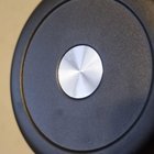 ​Small metallic (shiny plastic) disc glued to the bottom of 2 insulated water bottles (different brands).