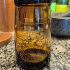 ​Weird jar found in Goodwill. Amber glass reminiscent of 60s/70s. Thick base. Top appears to be made to hold something.