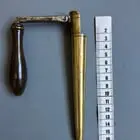 ​Hollow brass cone with wooden handle, most likely German