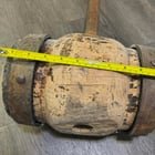 3ft wooden mallet with about 1ft wide head and metal rims. Tops 30lbs.