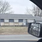 ​What are these external fixtures blocking the windows in front of this house? East coast USA