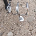 ​Small metal thing found next to a river. It has 3 prongs and each prong has 3 spikes on it.