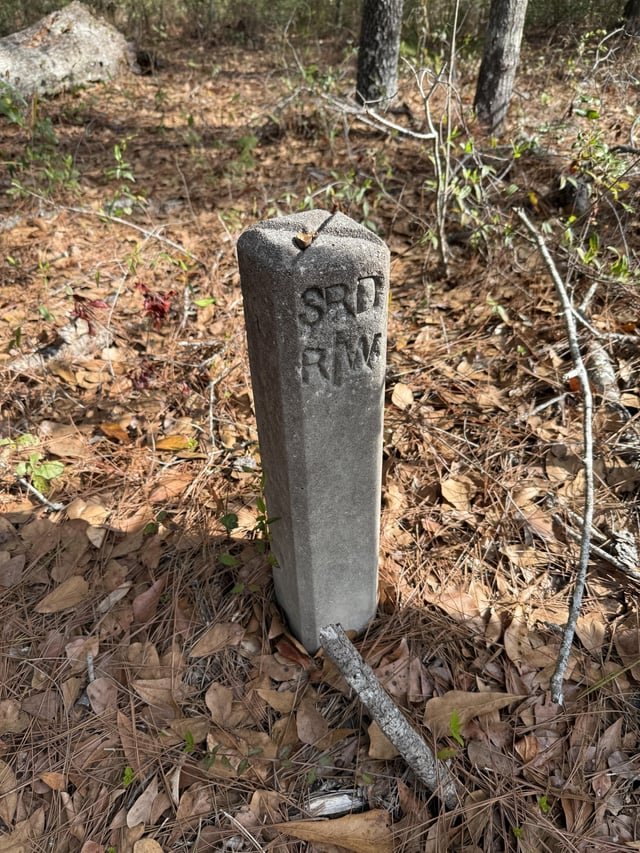 Found this in the middle of the woods. About knee height, made of cement. It was along a old roadbed
