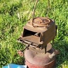 ​Metal contraption with fuel tank on bottom, found in an abandoned building. Seems to have been red at one time, very rusty and nothing seems to move anymore