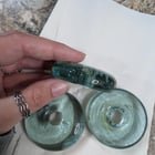 Fishing float? Aqua blue, glass, heavy. Found in a thrift store labeled “fishing float” but Google seems to disagree.