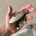 ​small, heavy, silver/silver plated thing with a hinge and black stains found on fleamarket
