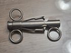 ​Found in a desk drawer at an estate sale. About 4.5″ long. Chrome or pickle plated. Depressing the slide brings the pincers together, but they are not sharp, more likely a clamp than a cutter. Image search only brings up syringes. Thanks in advance for any help. (Bananas for scale.)