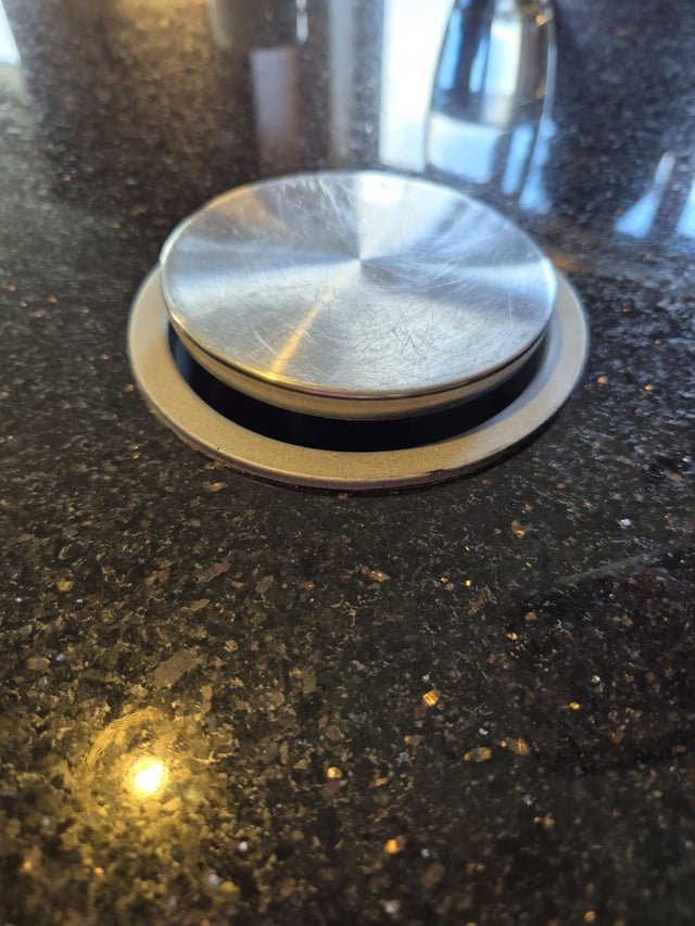 ​Pop up metal circle on airbnb kitchen counter