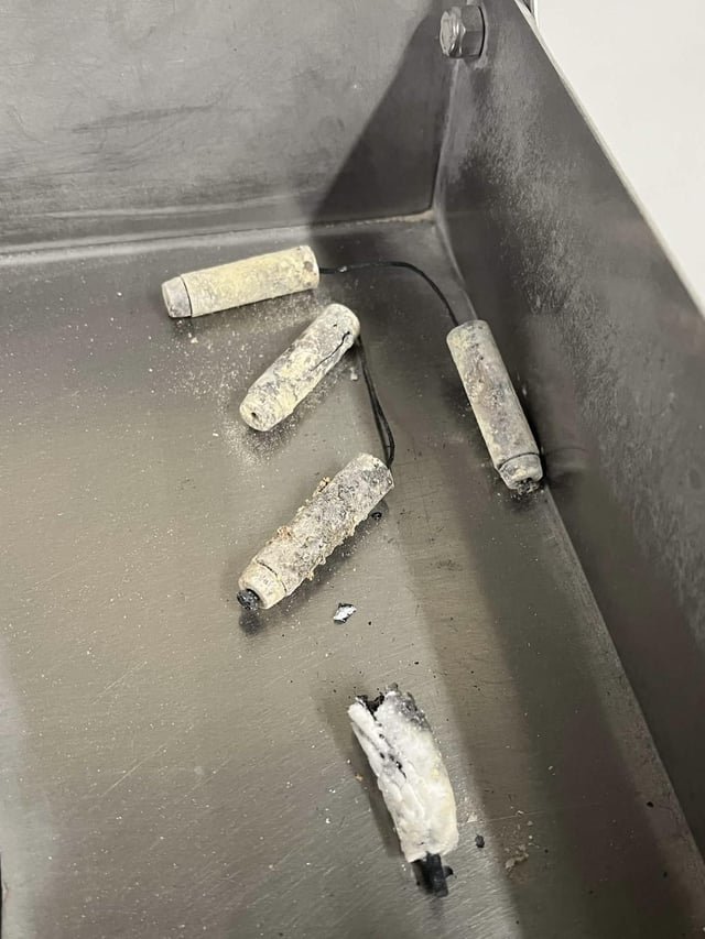 ​Found in male 60s-80s cremains, cylindrical parts about 4″, total roughly 7″, approx 17-18mm in diameter, metallic, one disintegrated and fused with the ashes, weren’t seen externally.