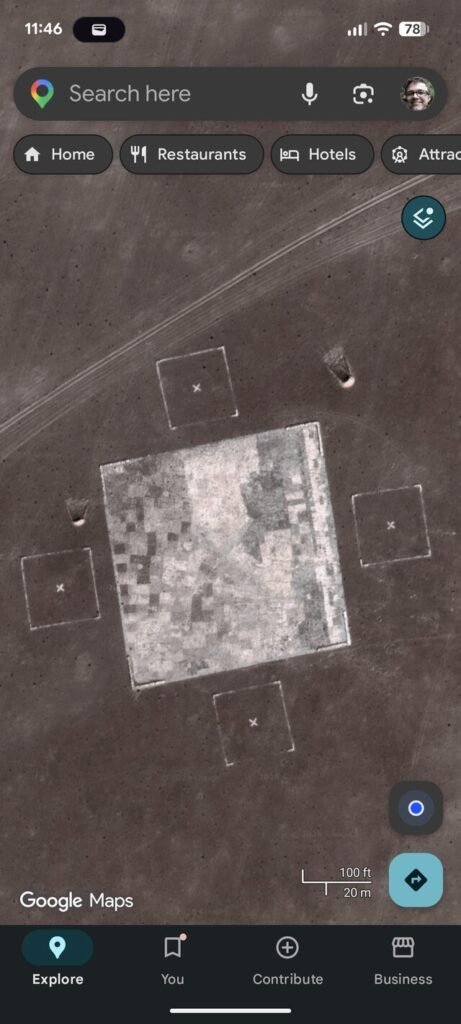 100x100m square surrounded by 30x30m squares in the middle of the desert. Big square almost looks like a map