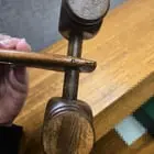 ​Looks like a wooden mallet with two heads, or a furniture component?