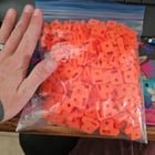 ​Orange (3d printed) plastic, hand for scale- tons of them left behind by a thru hiker