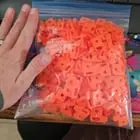 ​Orange (3d printed) plastic, hand for scale- tons of them left behind by a thru hiker